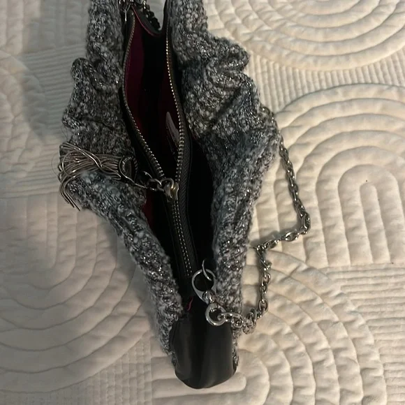 Shades of woven gray, and silver and black leather trim.Removable silver chain